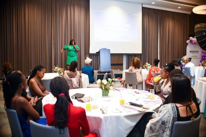 Coach Alice speaking and hosting