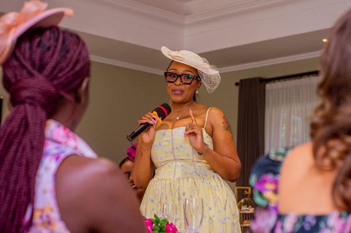 Coach Alice speaking and hosting